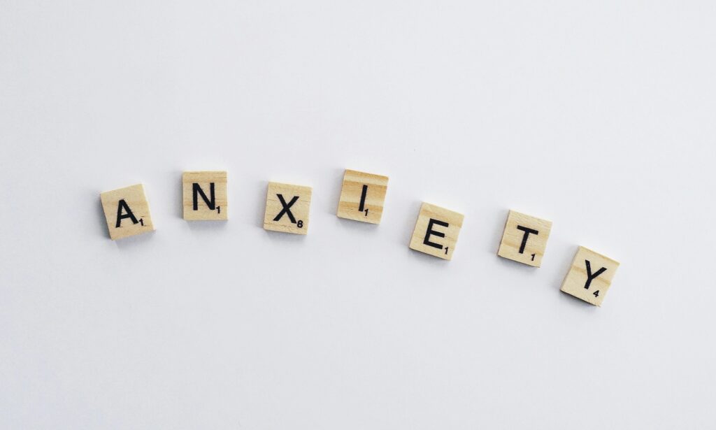 Wooden letters spelling the word 'anxiety'.